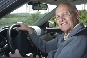 Happy senior man out for a drive